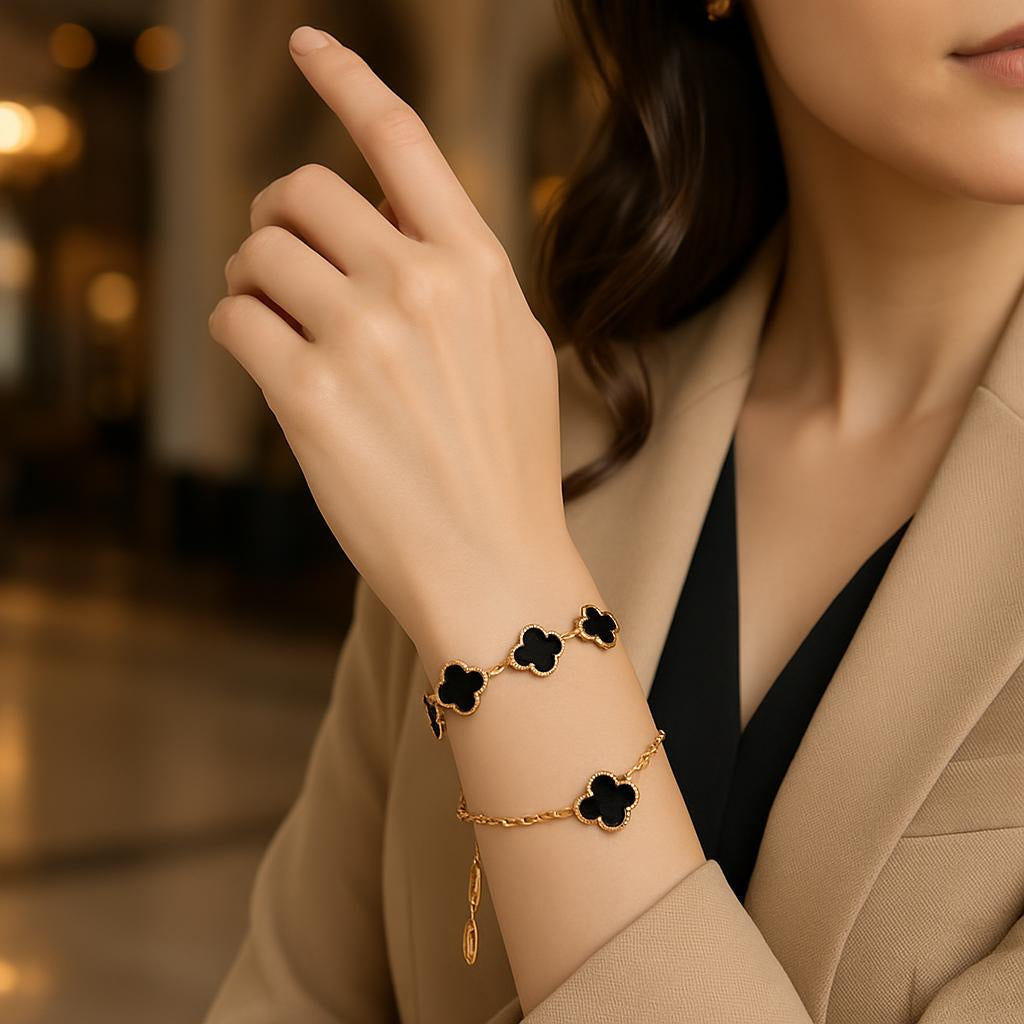 A lifestyle scene featuring a stylish woman wearing the bracelet on her wrist while dressed in an elegant outfit, with a blurred upscale background to evoke sophistication, showcasing the adjustable chain and the bracelet's fit for everyday and special occ
