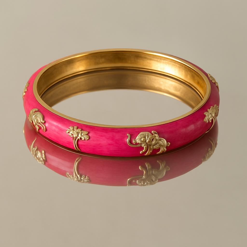 A studio shot featuring the bangle on a reflective surface, showcasing the detailed golden accents and glossy enamel from a top-down angle, with a blurred neutral background to focus on the product's craftsmanship.