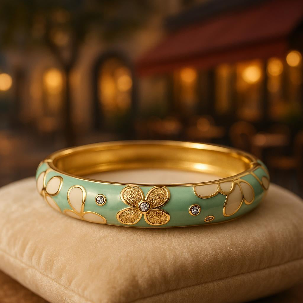 The bangle displayed on a luxurious, textured velvet cushion with a soft-focus background of a romantic café setting, emphasizing its elegance and intricate details.